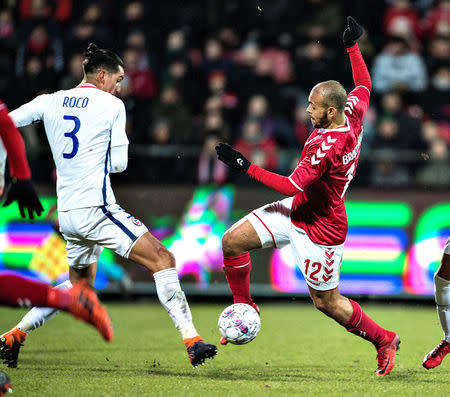 Denmark's Martin Braithwaite and Chile's Enzo Roco in action during an international friendly soccer match between Denmark and Chile at Aalborg Portland Park, in Aalborg, Denmark March 27, 2018. Scanpix Denmark/Henning Bagger/via REUTERS