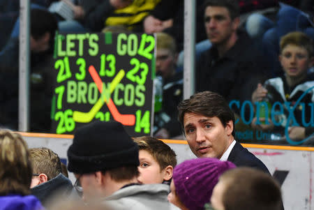 Prime Minister Justin Trudeau attends a vigil at the Elgar Petersen Arena, home of the Humboldt Broncos, to honour the victims of a fatal bus accident in Humboldt, Saskatchewan, Canada April 8, 2018. Jonathan Hayward/Pool via REUTERS