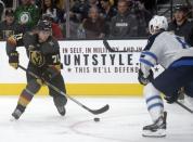 November 10, 2017; Las Vegas, NV, USA; Vegas Golden Knights center William Karlsson (71) moves the puck against Winnipeg Jets defenseman Jacob Trouba (8) during the second period at T-Mobile Arena. Mandatory Credit: Gary A. Vasquez-USA TODAY Sports