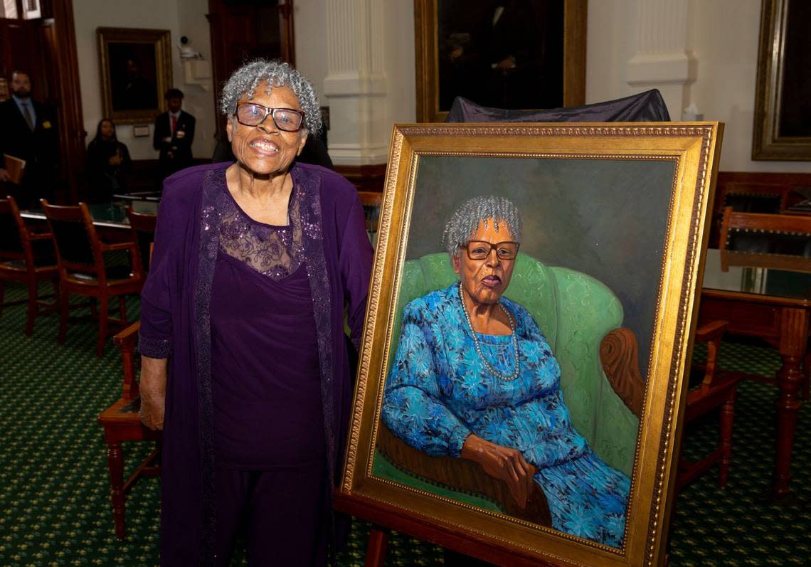 Opal Lee stands with her portrait that will hang in the Texas Senate.