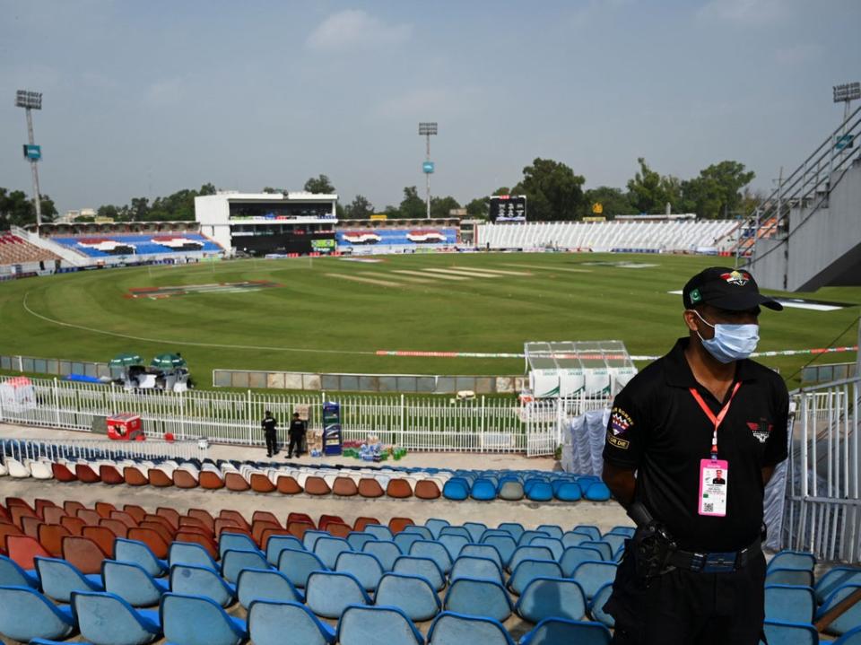 A policeman stands guard on the empty stands of the Rawalpindi Cricket Stadium in Rawalpindi (AFP)