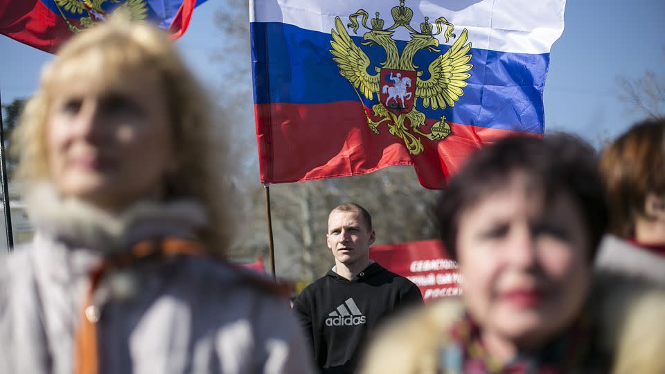 Pro-Russian supporters take part in a rally in Sevastopol, Crimea, on March 15, 2014. Displayed in the background are Russia's presidential flags. - Baz Ratner/Reuters