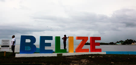 FILE PHOTO: People gather on a touristic boardwalk in Belize City, Belize June 22, 2016. REUTERS/Jose Cabezas/File Photo