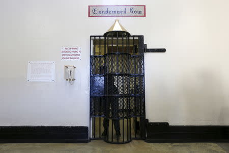 A guard closes a gate to death row during a media tour at San Quentin State Prison in San Quentin, California, December 29, 2015. REUTERS/Stephen Lam