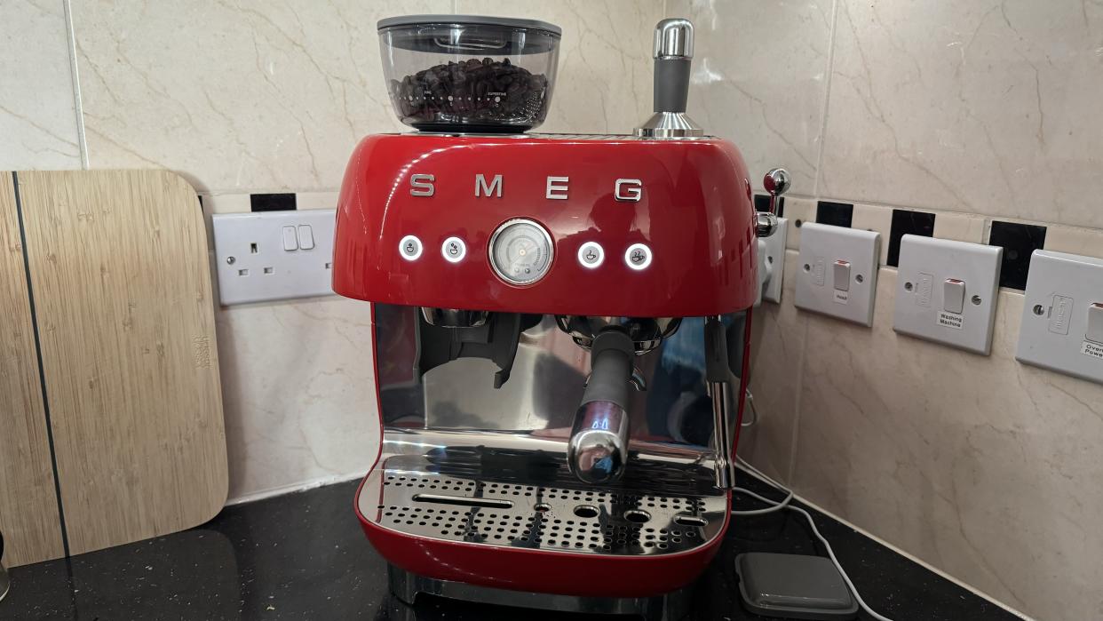  Smeg Espresso Coffee Machine EGF03 placed on a kitchen counter. 