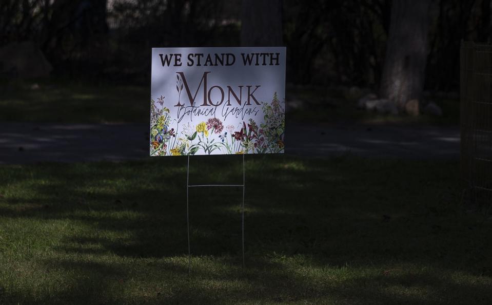 Yard signs stating "We Stand with Monk Botanical Gardens" are seen in front of multiple houses around the neighborhood right outside of the Wausau gardens on May 8 after their name was changed to the Wausau Botanic Gardens. On Wednesday, the board of directors for the botanical gardens announced it would reverse its decision to remove the Monk name from the gardens and return to the Monk Botanical Gardens name.