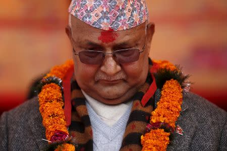 FILE PHOTO: Nepal's Prime Minister Khadga Prasad Sharma Oli, also known as K.P. Oli, observes a minute of silence for earthquake victims during an event organised to mark the 18th National Earthquake Safety Day and the official launch of earthquake reconstruction efforts in Bungamati village, Nepal January 16, 2016. REUTERS/Navesh Chitrakar/File photo