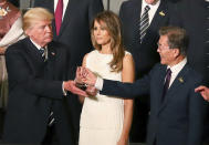 <p>President Donald Trump, left, shakes hands with South Korean President Moon Jae-in, right, next to Trump’s wife Melania, prior to a concert at the Elbphilharmonie concert hall on the first day of the G-20 summit in Hamburg, northern Germany, Friday, July 7, 2017. (Christian Charisius/Pool Photo via AP) </p>