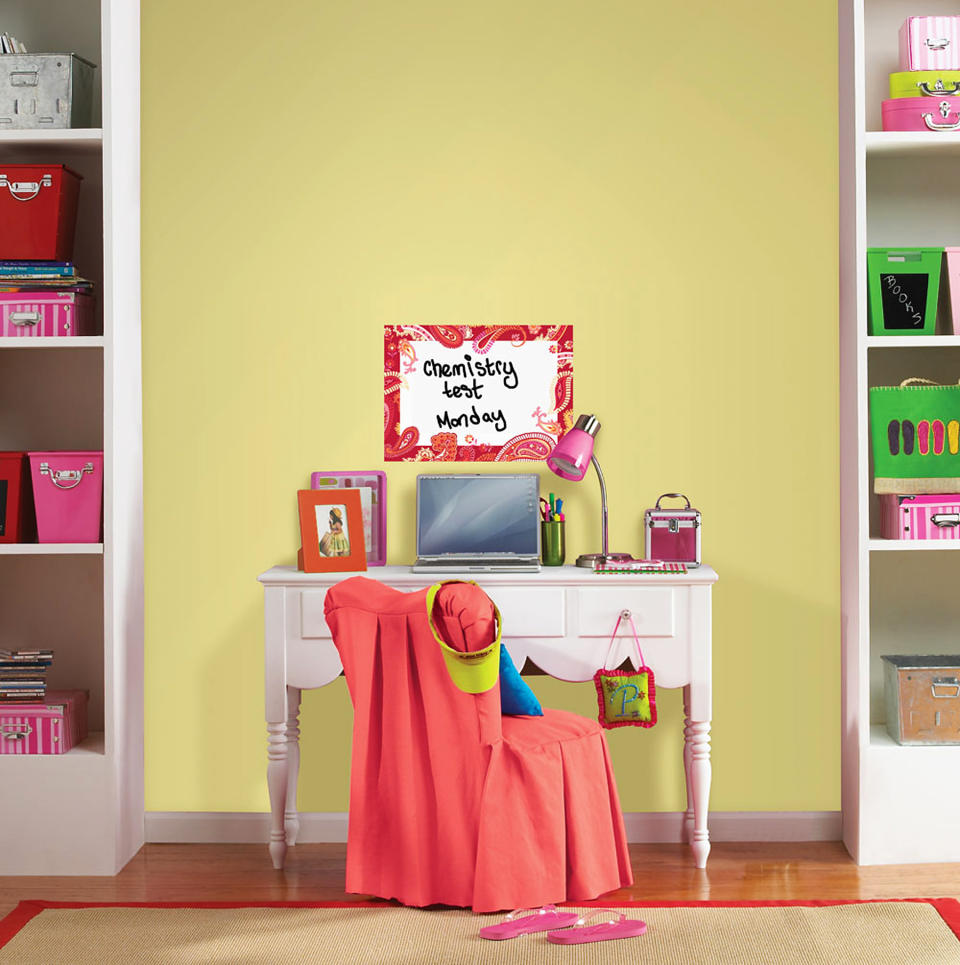 This publicity photo provided by courtesy of Brewster Home Fashions shows the WallPops Paisley Please Red Dry-Erase Message Board that can help keep a student's desk area organized. (AP Photo/Brewster Home Fashions)