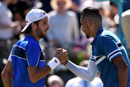 Tennis - ATP 500 - Fever-Tree Championships - The Queen's Club, London, Britain - June 22, 2018 Australia's Nick Kyrgios shakes hands with Spain's Feliciano Lopez after winning his quarter final match Action Images via Reuters/Tony O'Brien