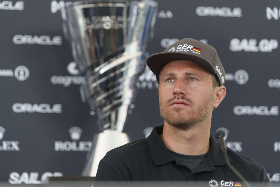 Team Germany skipper Erik Heil listens to questions during a news conference at the Los Angeles Sail Grand Prix, Friday, July 21, 2023, at the Port of the Los Angeles. Heil won bronze medals in consecutive Summer Olympics in the high-performance 49er skiff class. Having Sebastian Vettel as co-owner is "pretty cool," Heil said. "I think the cool thing about him is not that he's an investor, I think the cool thing is that he did for very long a professional racing series, and you feel that. When he's on the water, he's not like sitting there, he's making notes, and after we are back from the water, he is telling us from his point of view, what should be developed." (AP Photo/Damian Dovarganes)