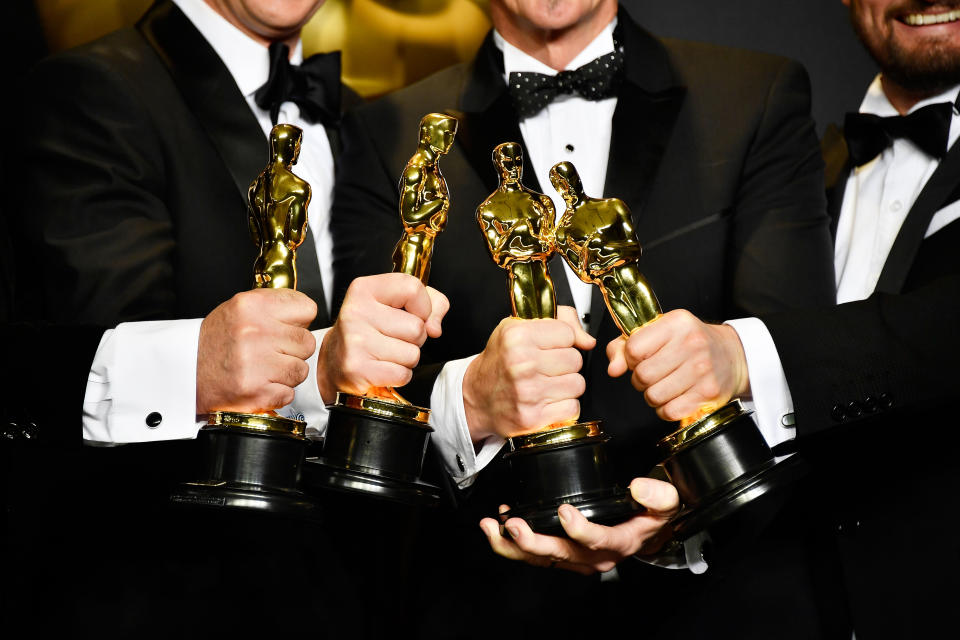 Academy Award statues.