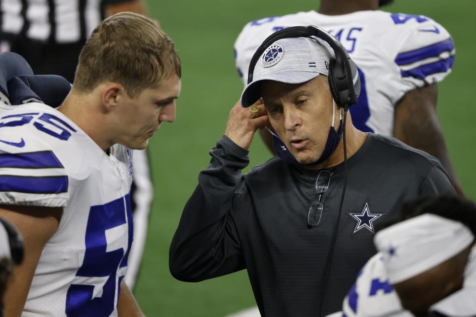 Dallas Cowboys linebacker Leighton Vander Esch (55) talks with defensive coordinator Mike Nolan, right, in the first half of an NFL football game against the Arizona Cardinals in Arlington, Texas, Monday, Oct. 19, 2020. (AP Photo/Ron Jenkins)