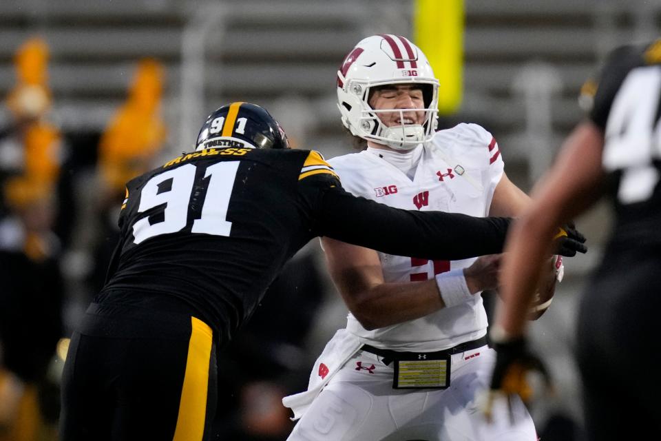 Wisconsin quarterback Graham Mertz is sacked by Iowa defensive lineman Lukas Van Ness during the first half last week. Mertz and the Badgers will look to bounce back against Nebraska on Saturday.