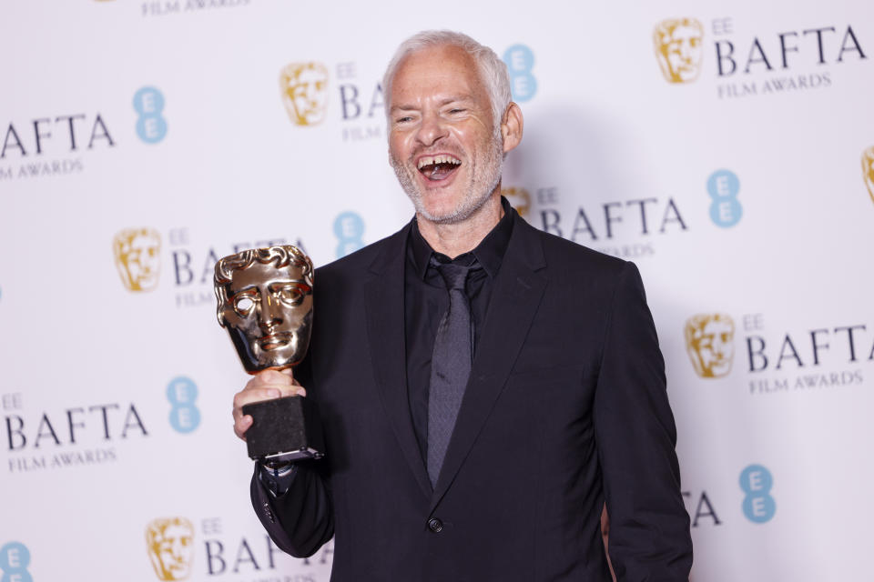 Martin McDonagh poses for photographers with the Original Screenplay award for the film 'The Banshees of Inisherin' at the 76th British Academy Film Awards, BAFTA's, in London, Sunday, Feb. 19, 2023 (Photo by Vianney Le Caer/Invision/AP)