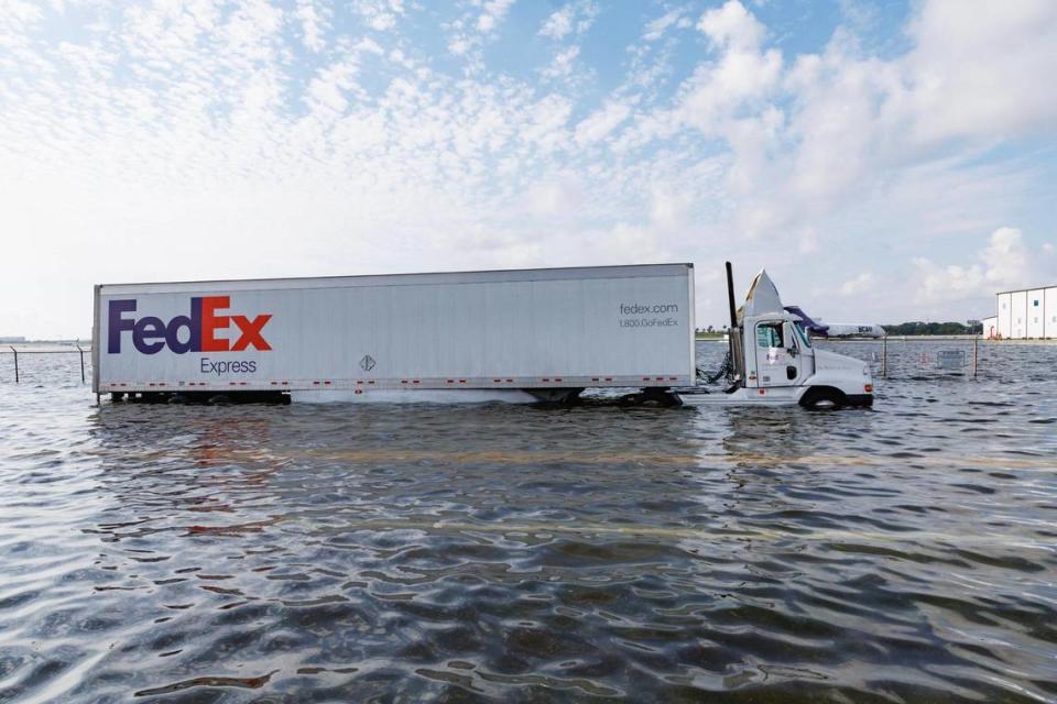 A Fedex truck on flooded West Perimeter Road in Fort Lauderdale on Thursday, April 13, 2023.