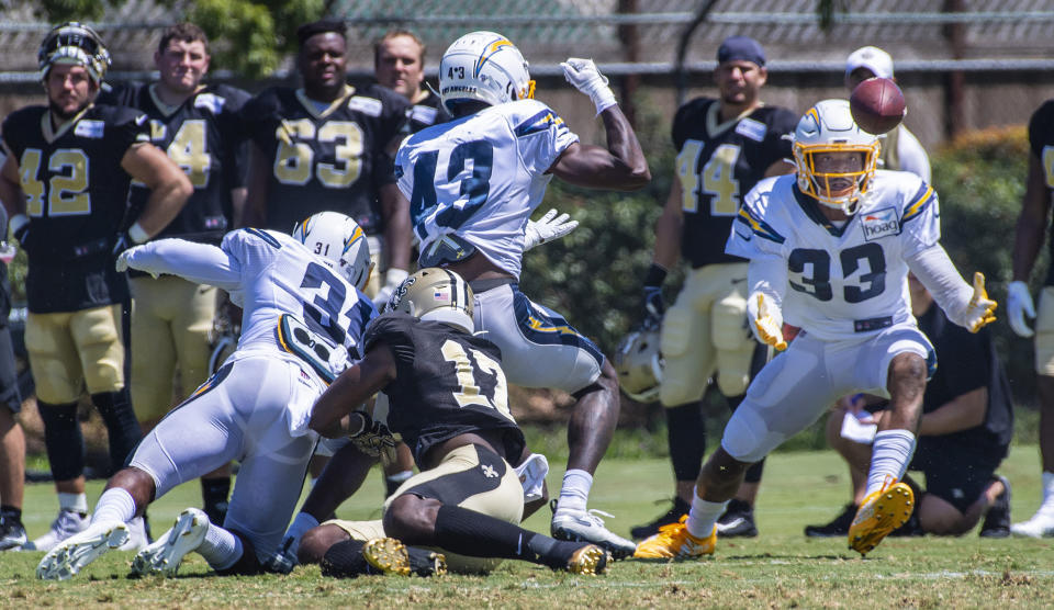 Los Angeles Chargers safety Derwin James Jr., right, catches a tipped pass during the NFL football team's joint practice with the New Orleans Saints on Thursday, Aug. 15, 2019, in Costa Mesa, Calif. (Mark Rightmire/The Orange County Register via AP)