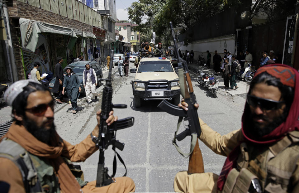 FILE - In this Thursday, Aug. 19, 2021 file photo, Taliban fighters patrol Kabul, Afghanistan,. The Taliban celebrated Afghanistan's Independence Day on Thursday by declaring they beat the United States, but challenges to their rule ranging from running a country severely short on cash and bureaucrats to potentially facing an armed opposition began to emerge. (AP Photo/Rahmat Gul, File)