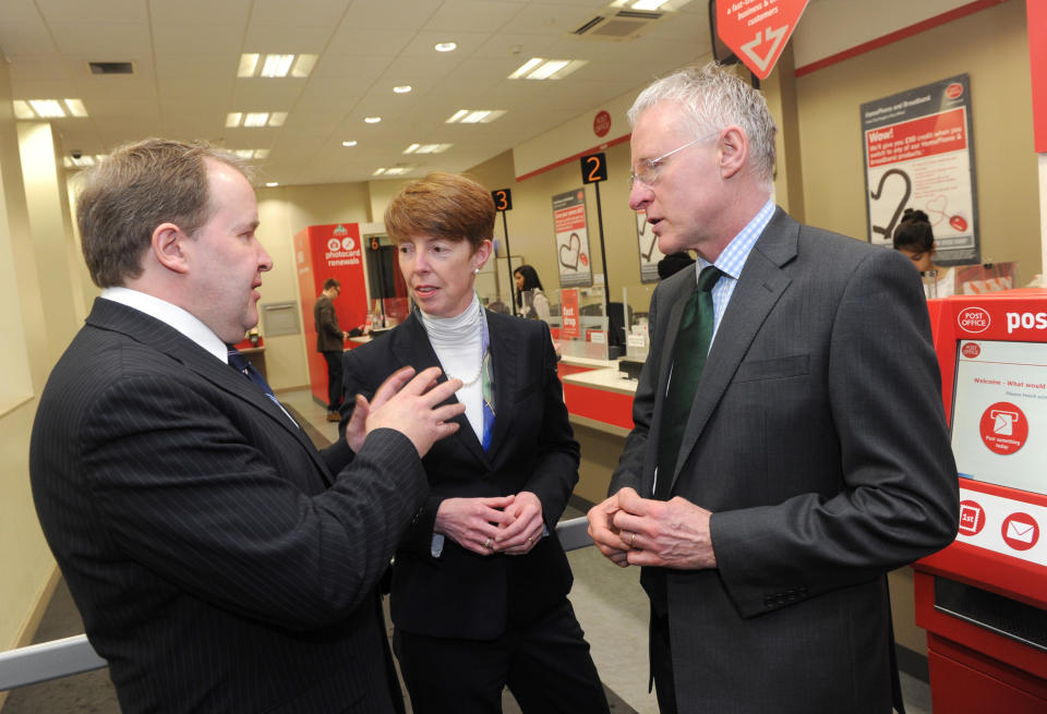 George Thomson, General Secretary of the National Federation of Subpostmasters (left), speaks to Post Office Chief Executive Officer Paula Vennells and Postal Secretary Norman Lamb during a visit to Farringdon Road Post Office in London to reveal details of how the government 1.3 billion euros will be used for the Post Office Network.  (Photo by Anthony Devlin/PA Images via Getty Images)