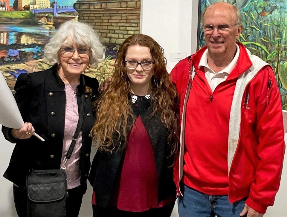 Mary Ann Bucci and Ron Bucci present Diana Wilson with the 2022 Ronna Bucci and Dr. Charles Dietz Artist Award at the ZAAP Gallery.