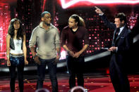 (L-R) Contestants Jessica Sanchez, Joshua Ledet and DeAndre Brackensick and host Ryan Seacrest onstage at FOX's 'American Idol' Season 11 Top 10 To 9 Live Elimination Show on March 22, 2012 in Hollywood, California. (Photo by FOX via Getty Images)