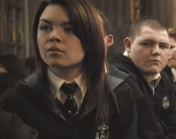 closeup of her in the hogwarts uniform