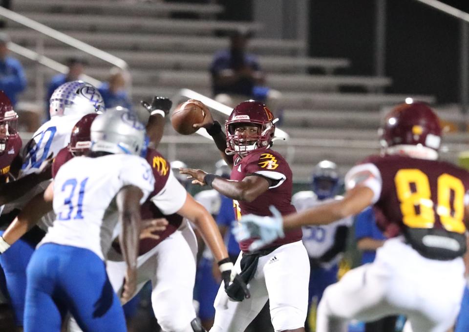 New Hampstead quarterback Rashawn Truell looks to pass the ball downfield against the Burke County defense during a 2023 game at Pooler Stadium.