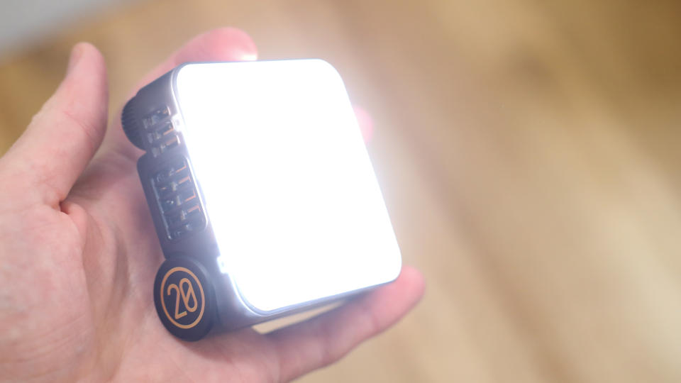 Zhiyun FIVERAY M20C LED panel held in a hand