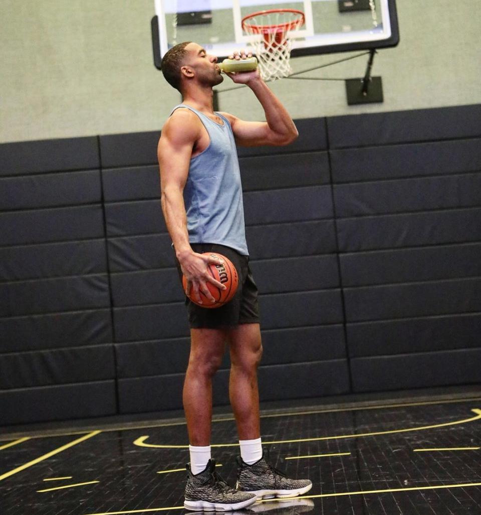 a photo of matt james holding a basketball