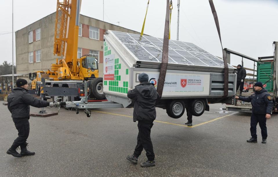 <div class="inline-image__caption"><p>Employees of the State Emergency Service of Ukraine unload mobile power generating station as part of international humanitarian aid in the city of Kharkiv on Nov. 21, 2022. </p></div> <div class="inline-image__credit">Sergey Bobok/AFP via Getty Images</div>