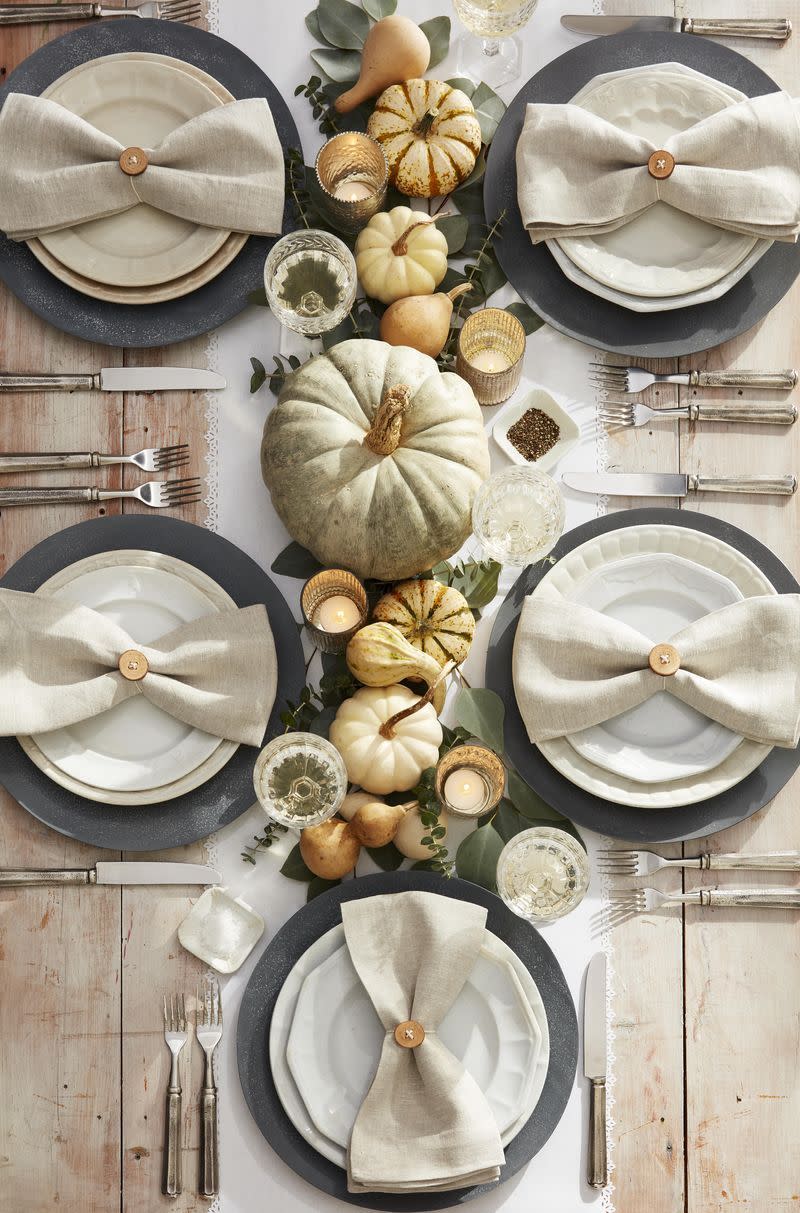 <p>Full of neutral tones, including painted pumpkins, this setting is modern and sophisticated.</p><p><a class="link " href="https://www.amazon.com/Vintage-Handmade-Serviette-Thanksgiving-Farmhouse/dp/B098FCD1XJ?tag=syn-yahoo-20&ascsubtag=%5Bartid%7C10070.g.23289609%5Bsrc%7Cyahoo-us" rel="nofollow noopener" target="_blank" data-ylk="slk:SHOP CIRCLE NAPKIN RINGS;elm:context_link;itc:0;sec:content-canvas">SHOP CIRCLE NAPKIN RINGS</a></p>