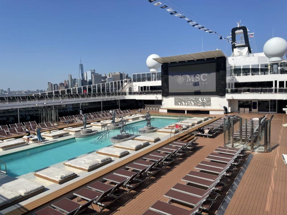 The New York City skyline behind Meraviglia's Atmosphere Pool.