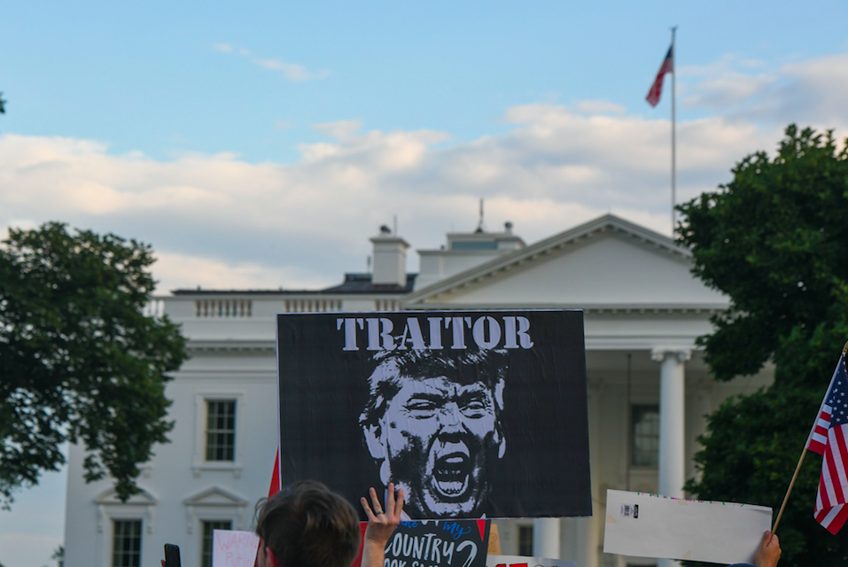 <em>Protests outside the White House declared Trump a ‘traitor’ (Rex)</em>