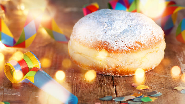 powdered fasnacht donut on table