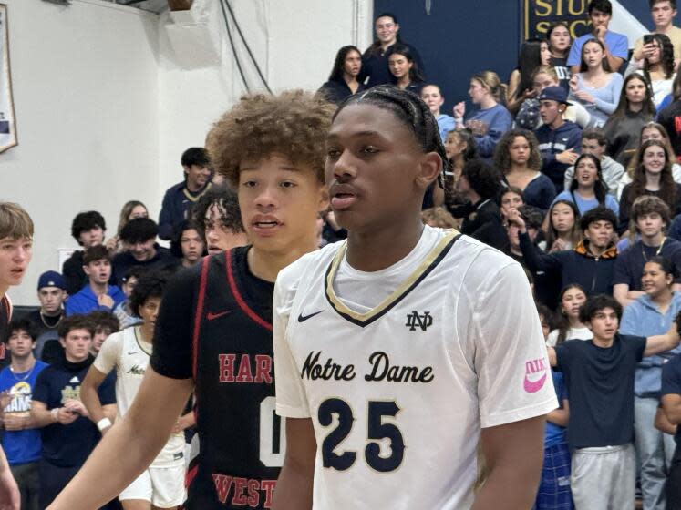 Trent Perry of Harvard-Westlake (left) scored 22 points. Mercy Miller of Sherman Oaks Notre Dame scored 33 points.