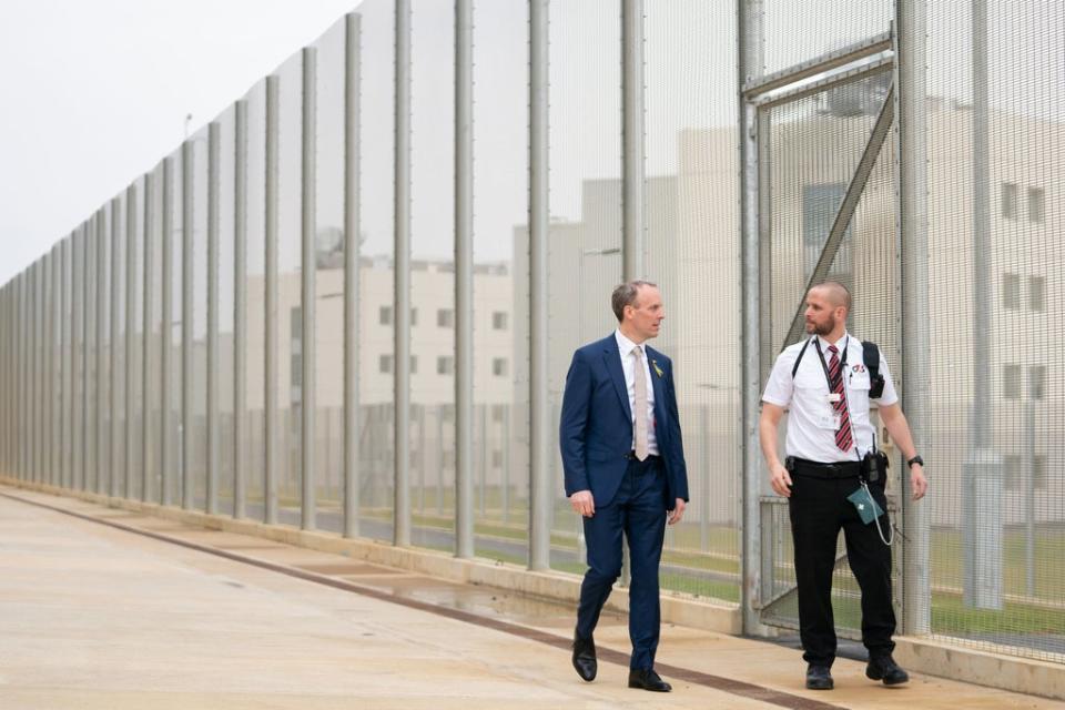 Deputy Prime Minister and Justice Secretary Dominic Raab with a prison officer at the opening of HMP Five Wells in Wellingborough in March (Joe Giddens/PA) (PA Wire)