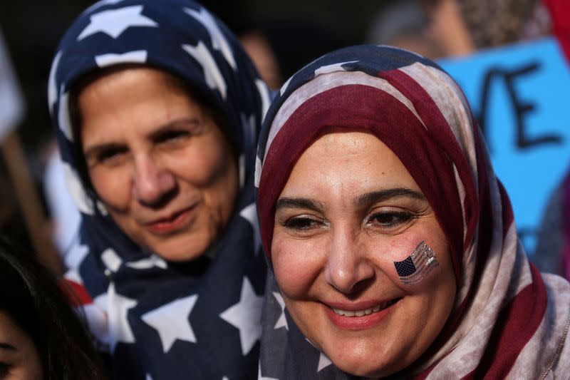 FILE PHOTO: Women wearing U.S. flag hijabs are pictured during an "I am Muslim Too" rally in Times Square, Manhattan, New York