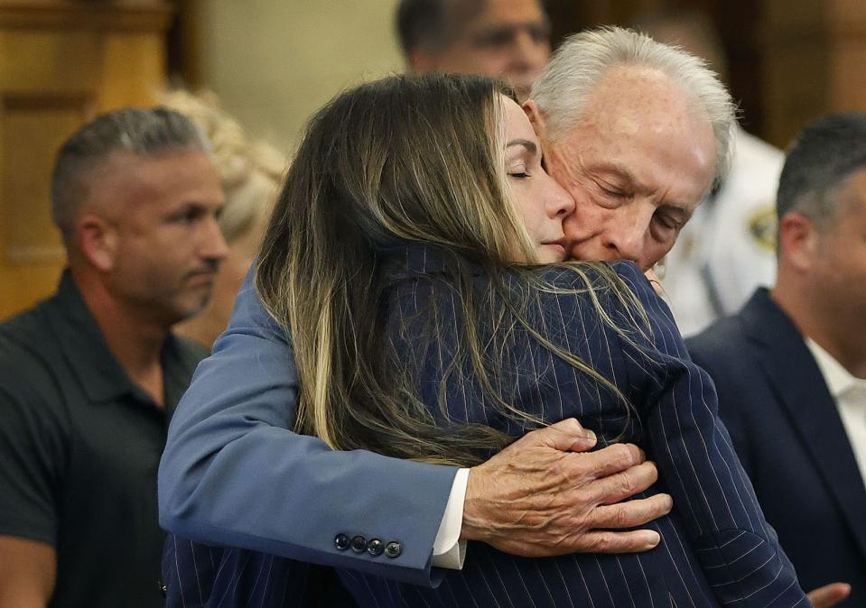 Karen Read gets a long hug from her dad William before the jury breaks for lunch at Norfolk Superior Court in Dedham, Mass., Wednesday June 26, 2024. (Greg Derr/The Patriot Ledger via AP, Pool)