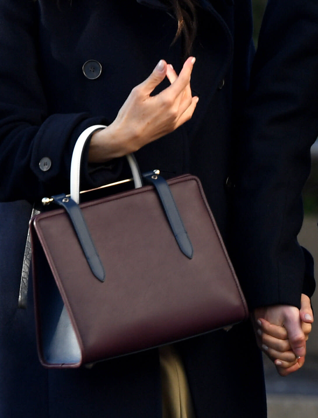 Meghan wore Strathberry's tri-colour tote bag in Nottingham in December 2018 [Photo: PA]