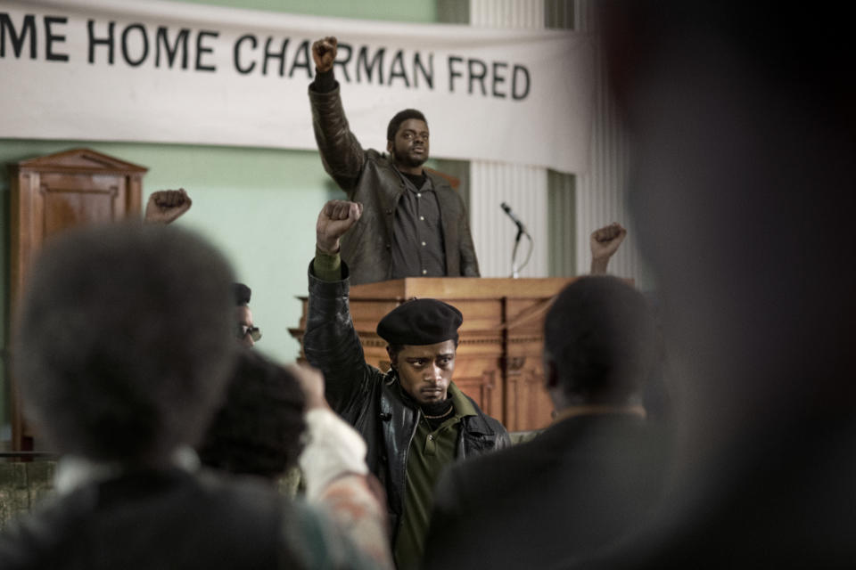This image released by Warner Bros. Pictures shows Lakeith Stanfield, foreground center, and Daniel Kaluuya, background center, in a scene from "Judas and the Black Messiah." The film will release in theaters and on HBO Max on Friday. (Warner Bros. Pictures via AP)