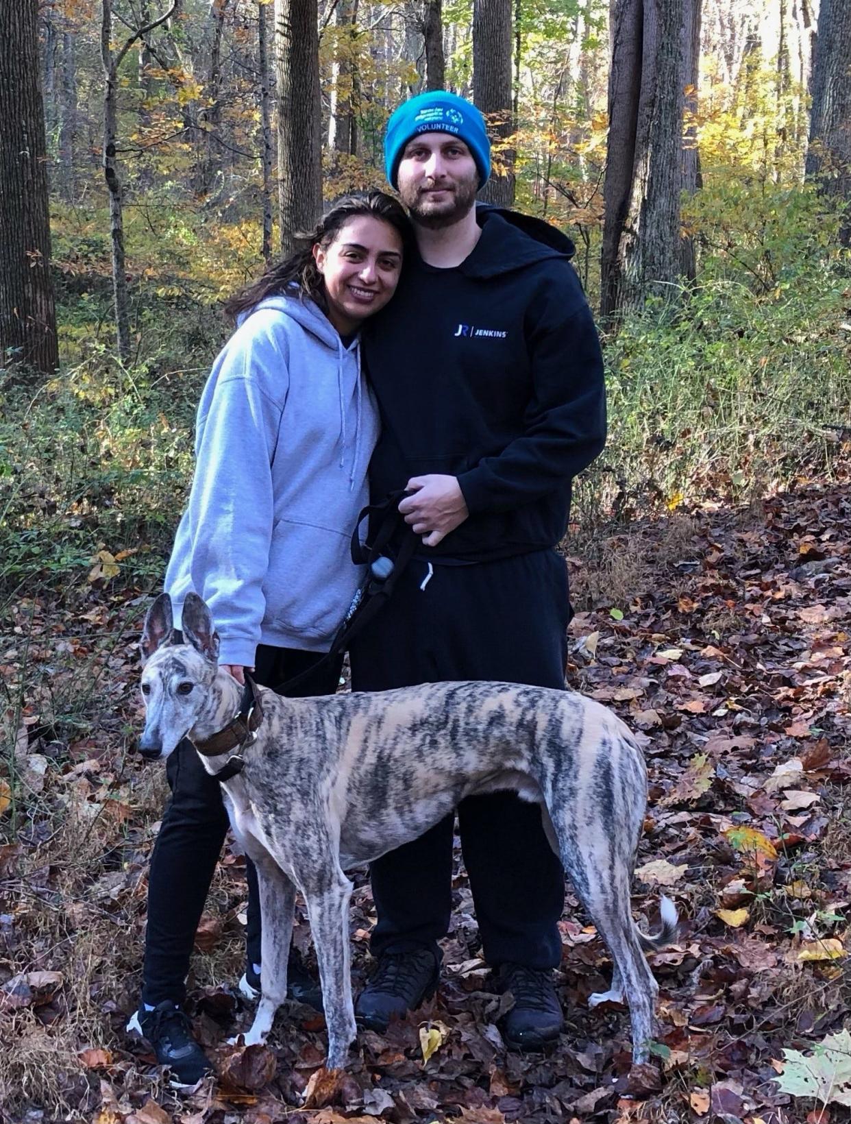 Angie and Micah Cacopardo with their greyhound Lenny, whose treatment after being severely injured by another dog cost $17,000.