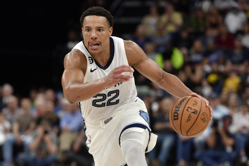 Memphis Grizzlies guard Desmond Bane (22) handles the ball in the second half of an NBA basketball game against the Portland Trail Blazers Tuesday, April 4, 2023, in Memphis, Tenn. (AP Photo/Brandon Dill)