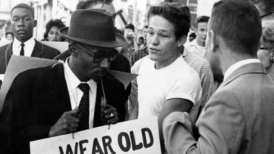 Archival photo (1960) Rev. C.K Steele picketing downtown stores during demonstration in Tallahassee.
Source: Florida Memory.