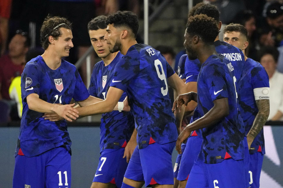 United States forward Ricardo Pepi (9) celebrates with teammates after he scored a goal against El Salvador during the second half of a CONCACAF Nations League soccer match Monday, March 27, 2023, in Orlando, Fla. (AP Photo/John Raoux)