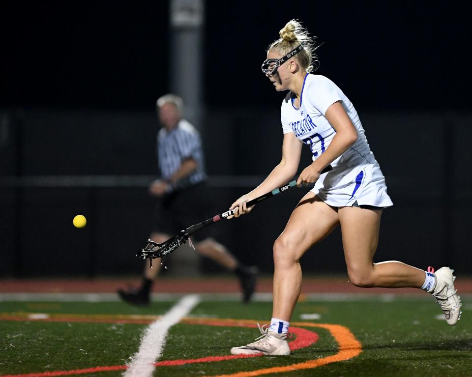 Decatur's Sadie Kauffman (27) scoops the ball in the match against Queen Anne's Monday, May 8, 2023, in Berlin, Maryland. Queen Anne's defeated Decatur 9-3 to win the Bayside Championship.