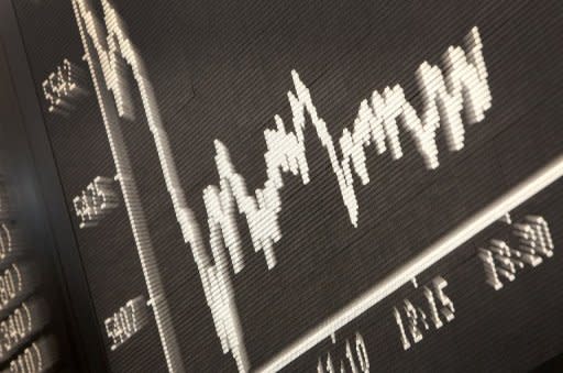 A board displays the chart of Germany's share index DAX at the stock exchange in Frankfurt. Greece's Prime Minister George Papandreou plunged the euro back into crisis and sent share prices into a tailspin with a shock announcement that he would put a hard-fought rescue deal to a referendum