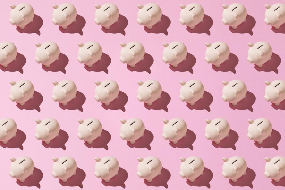 An image of piggy banks on a pink background.