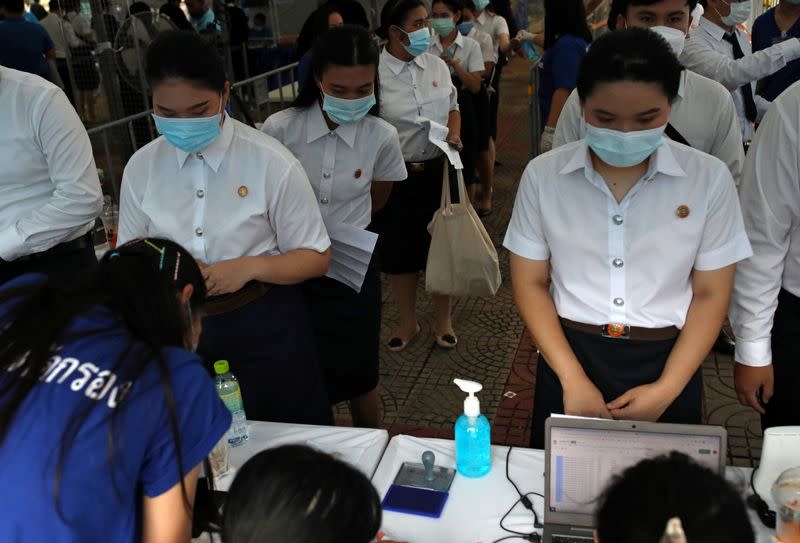 Students attend their graduation ceremony led by King Maha Vajiralongkorn, at Thammasat University in Bangkok