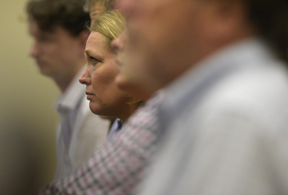 Nicole Hockley, mother of Dylan Hockley, listens as FBI agent William Aldenberg testifies during the first day of Alex Jones' Sandy Hook defamation damages trial at Waterbury Superior Court, Tuesday, Sept. 13, 2022, in Waterbury, Conn. Dylan Hockley was one of 26 killed in the 2012 mass shooting in Newtown, Conn. (H John Voorhees III/Hearst Connecticut Media via AP, Pool)