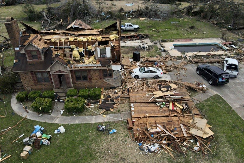 Debris is strewn about a tornado damaged home, Sunday, March 26, 2023, in Rolling Fork, Mississippi.